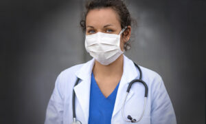 Female doctor wearing a white mask