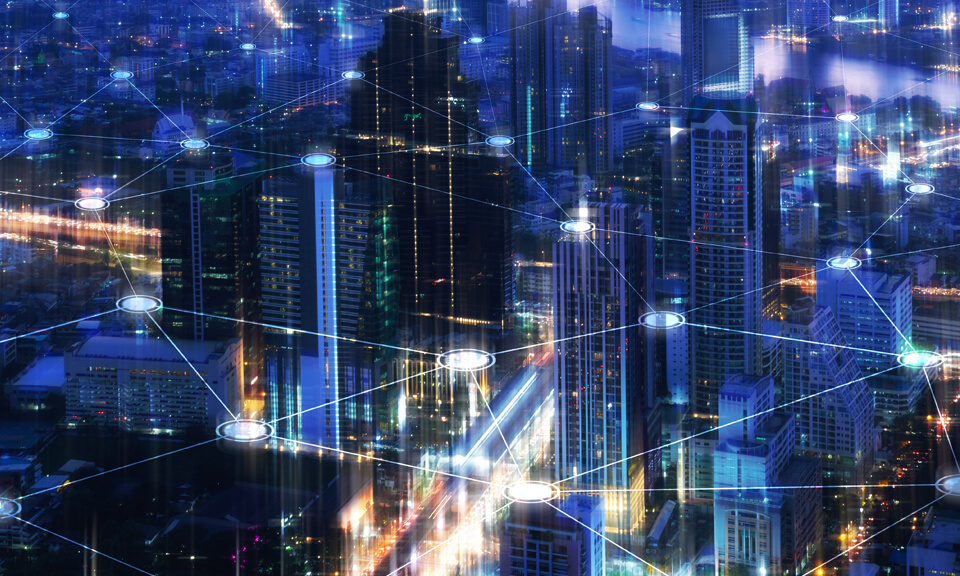 Blurred city landscape with lights connected with network lines