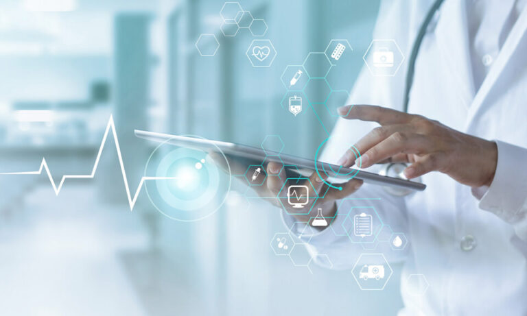 medical hands holding a tablet against a passageway background