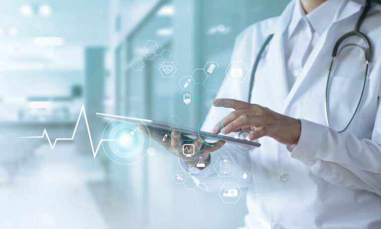 medical hands holding a tablet against a passageway background