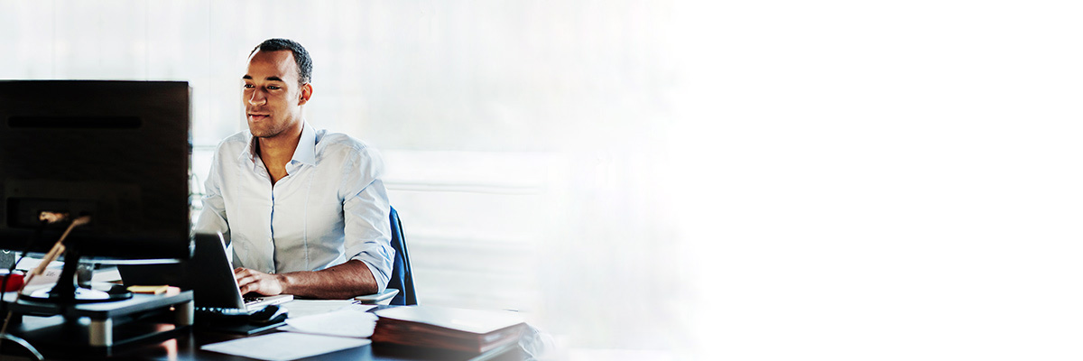 Businessman on laptop at desk