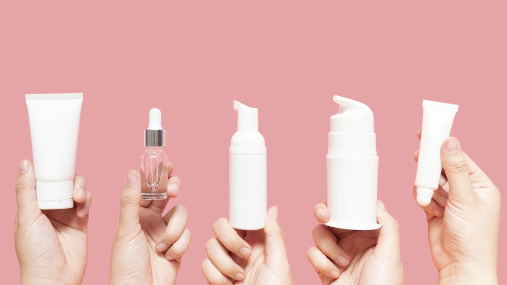hands holding lotions and hand creams