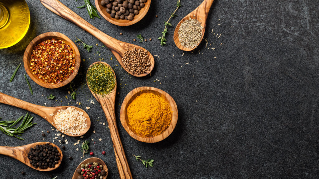 Spices on wooden spoons