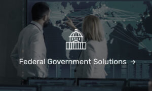 Federal Government solutions icon over 2 people working on a global map
