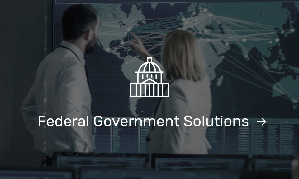 Federal Government solutions icon over 2 people working on a global map