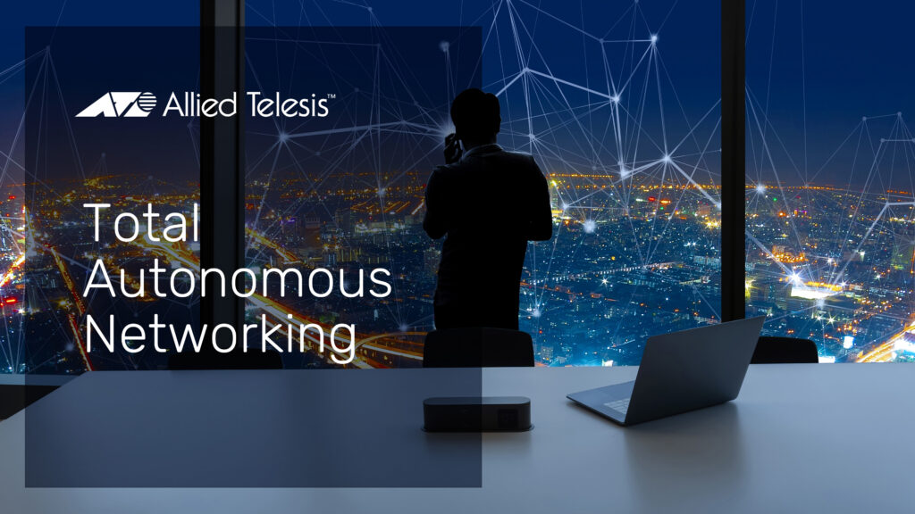 Businessman in office at night watching glowing city network activity