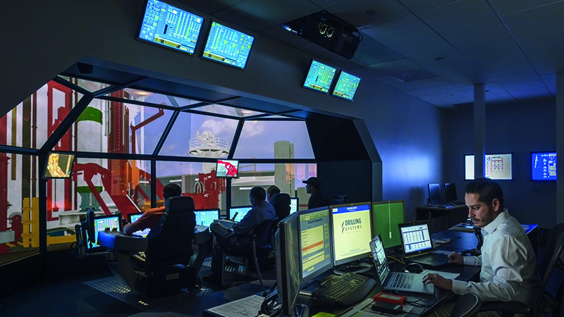 Oil rig workers in the control room